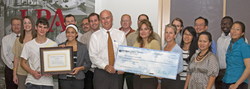 LPA employees present a check to the Boys & Girls Club of Laguna Beach with Pro Repro