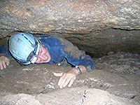 Erik Pollock of the Stable Isotope Laboratory at the University of Arkansas, climbs into tight spaces to study carbon dioxide cycling in caves. Seasonal differences can provide clues to paleoclimate proxies