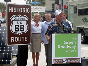 Jim Conkle, Chairman and CEO of the Route 66 Alliance, officially endorses The Green Roadway technology. Spokesperson Kelly Meyer and inventors Gene Fein and Ed Merritt stand in the background