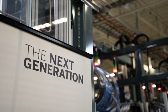Event signage at the opening of the factory expansion.
