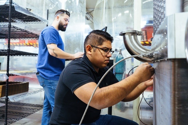 Nel Hydrogen engineers working on the PEM electrolyzers.