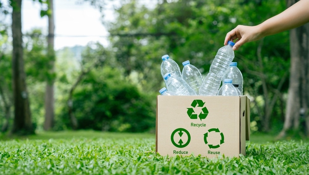 recyclable plastic bottles in brown box