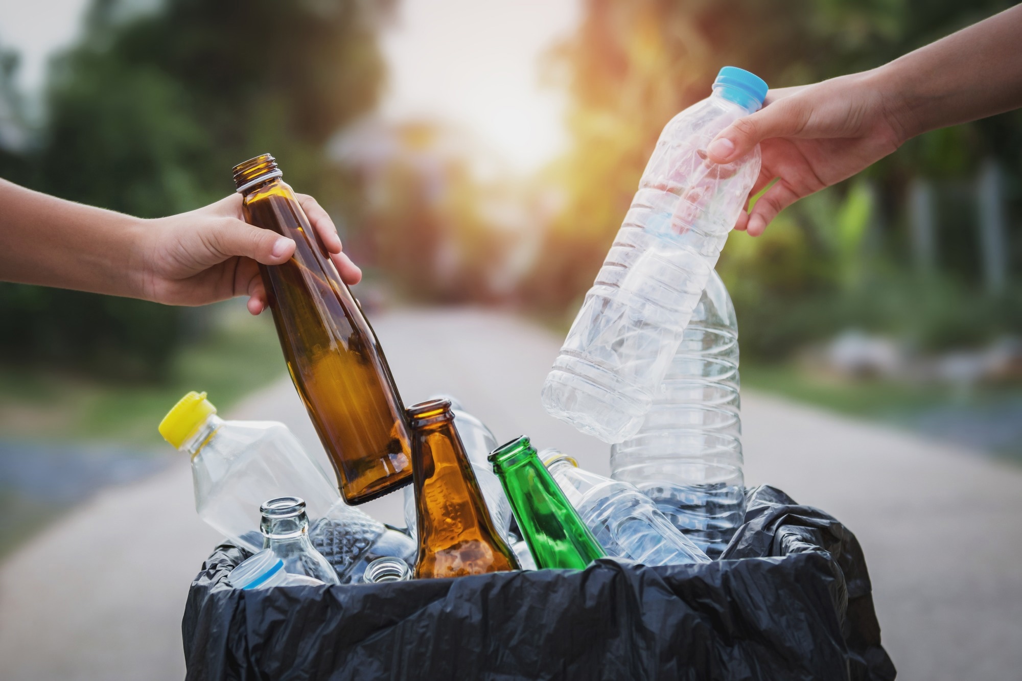 glass bottles and plaatic bottles in a bag