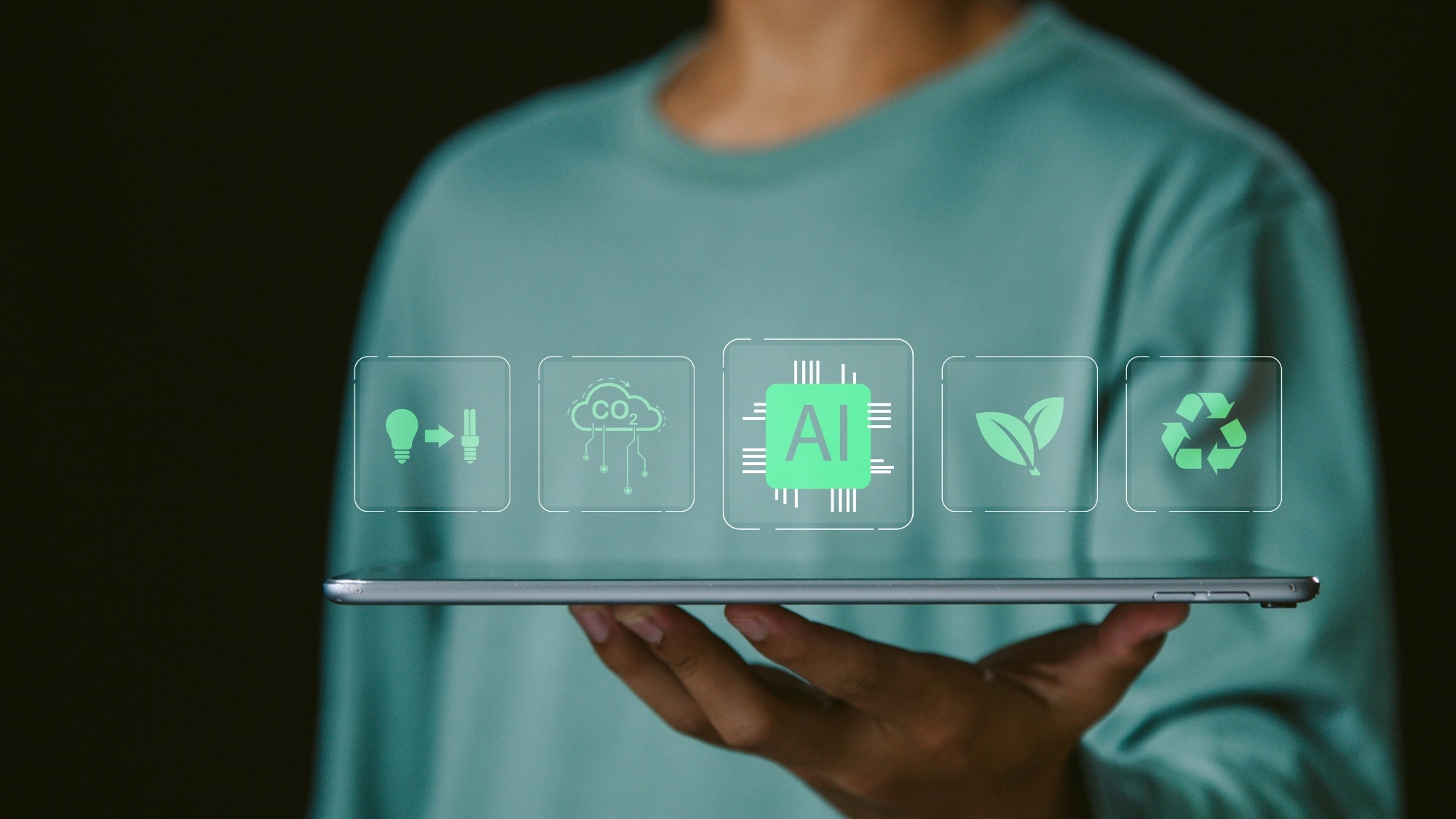 man holding laptop with AI hologram on top