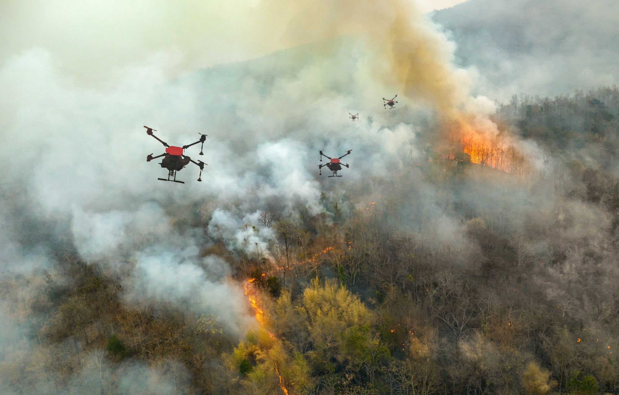 drones hover over a wildfire