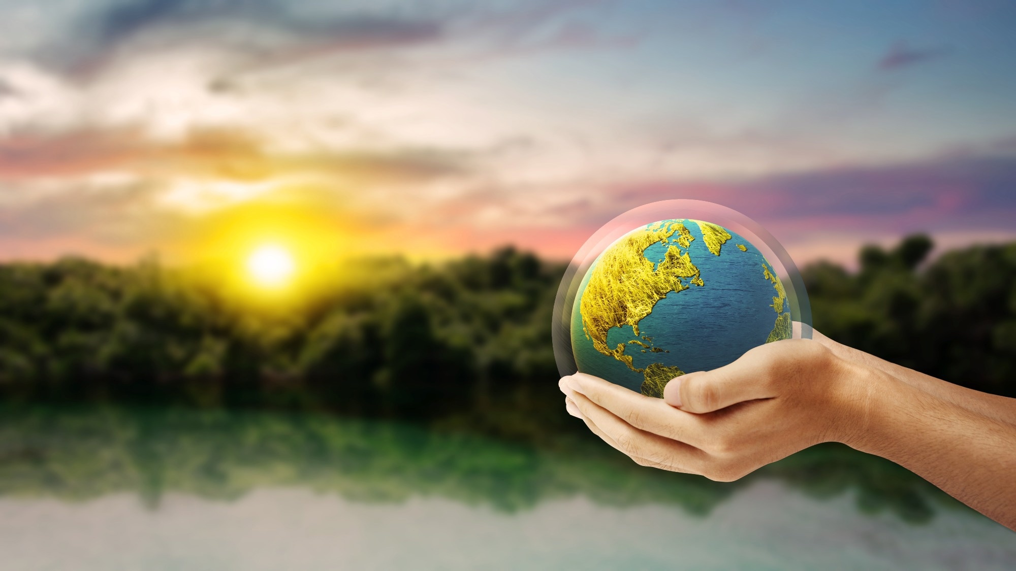 holding earth in hand with layer around it to protect it