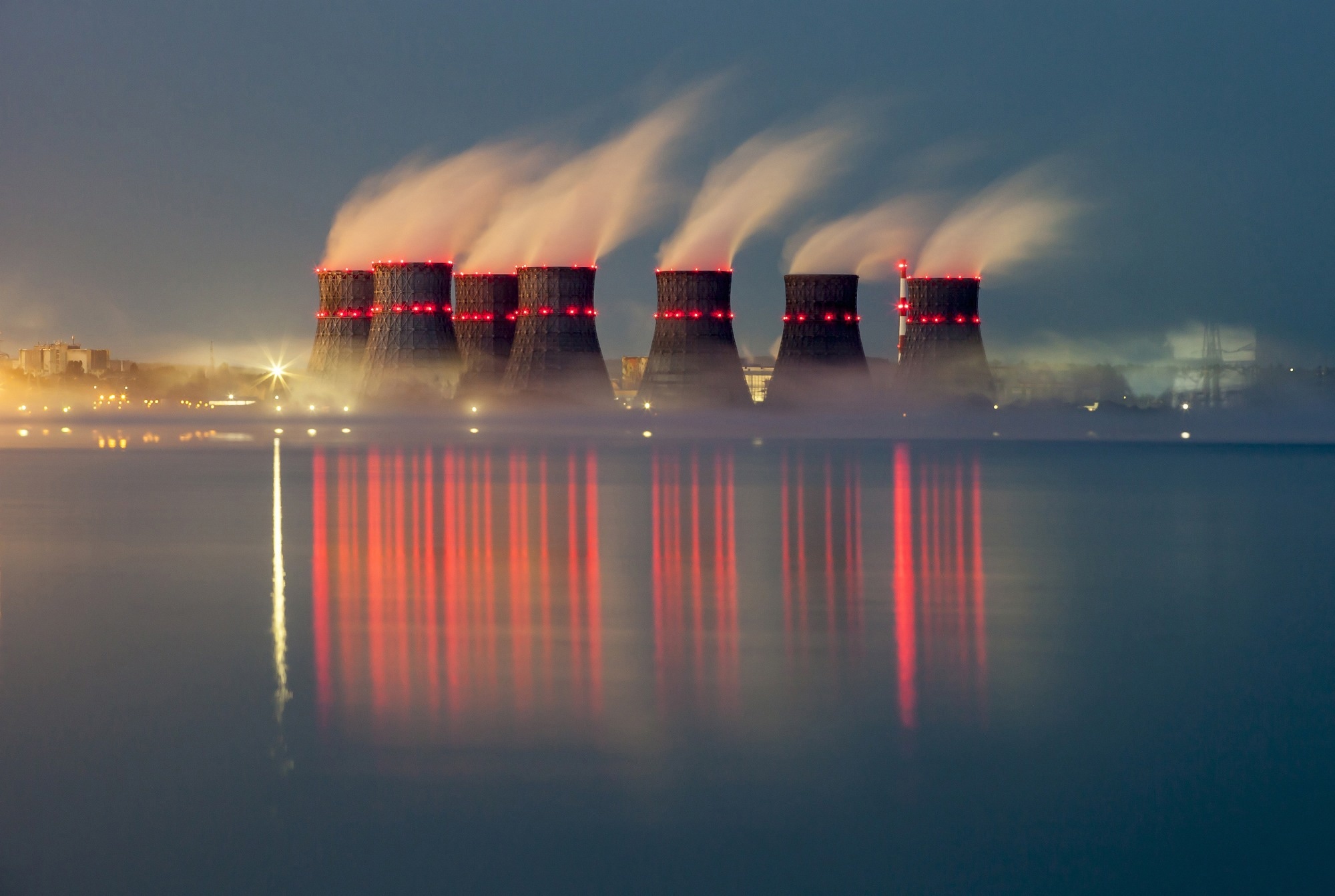 nuclear power plants at night lit up