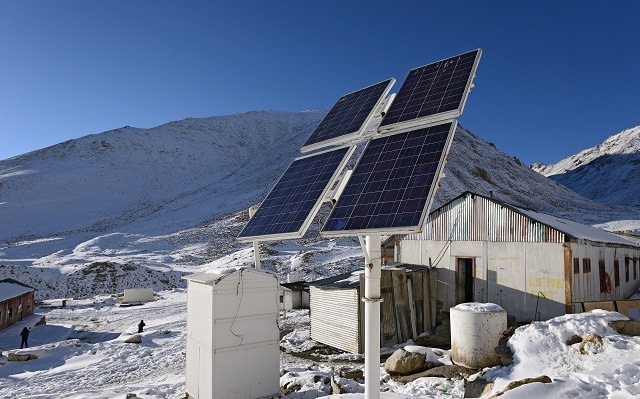 Solar panels on top of a snowy mountain in Ladakh, India