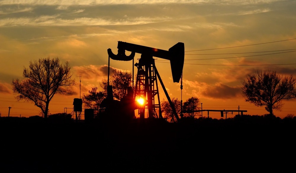 abandoned oil well, sunset