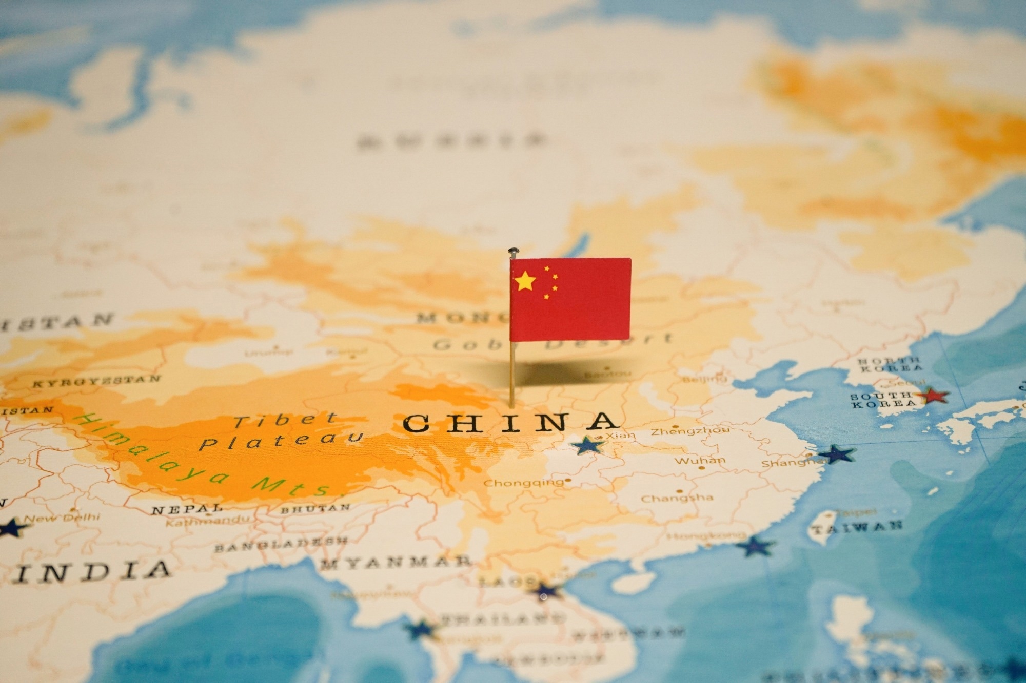 The Flag of China on the World Map.