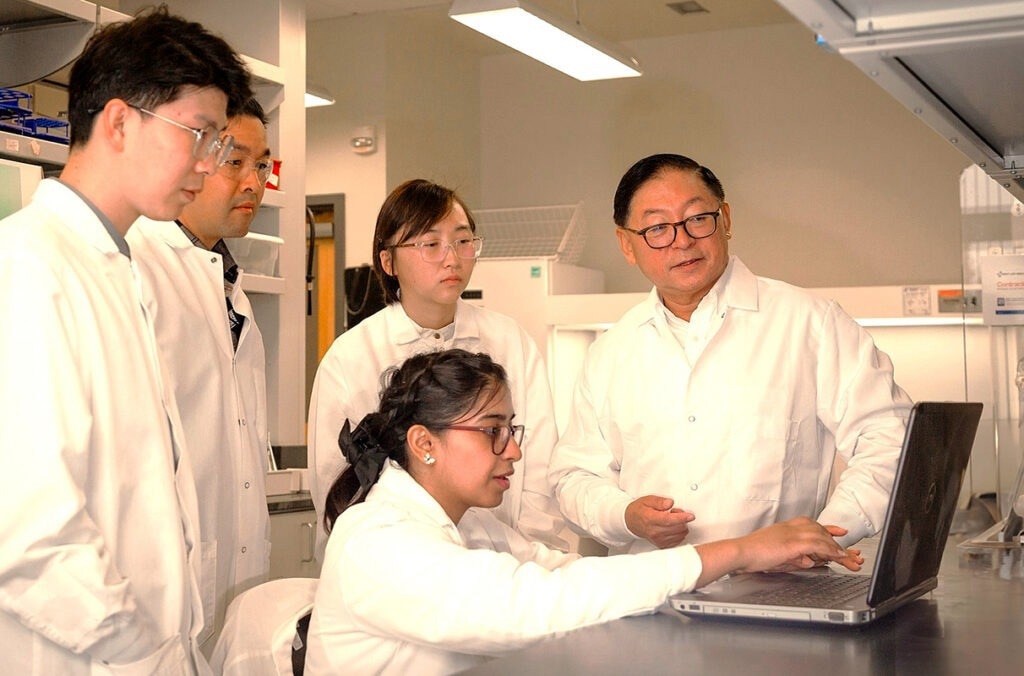 Developing new and sustainable fuels and products from biomass, Professor Bin Yang works with members of his lab at WSU Tri-Cities. Yang led research into new, economically feasible production of sugar for biofuels.