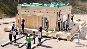 Students Design the NeighborHub with Solar Panels Installed on the Building's Façade
